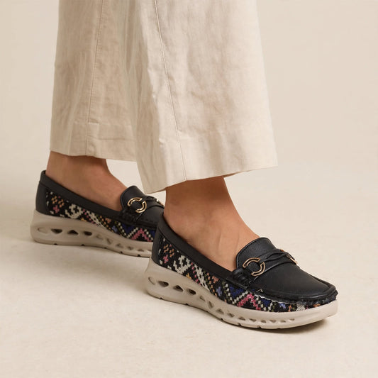 Women's black woven casual loafers with gold buckle - front view